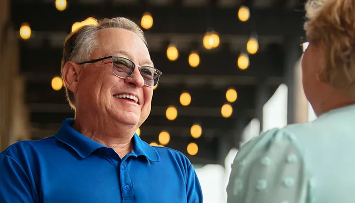 The old man is chatting.