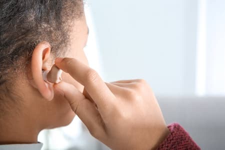 Children wear hearing AIDS by themselves