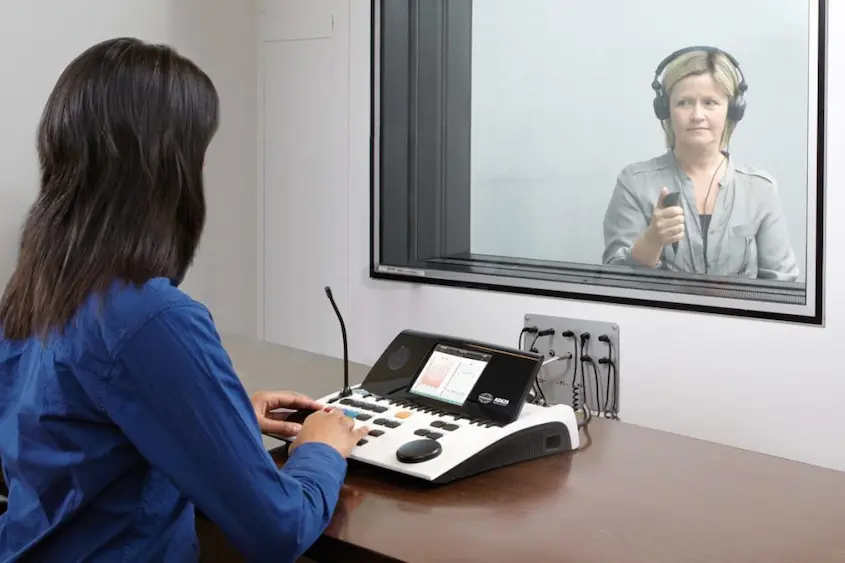 The audiologist is testing hearing