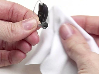 Wipe the hearing aid with a cloth